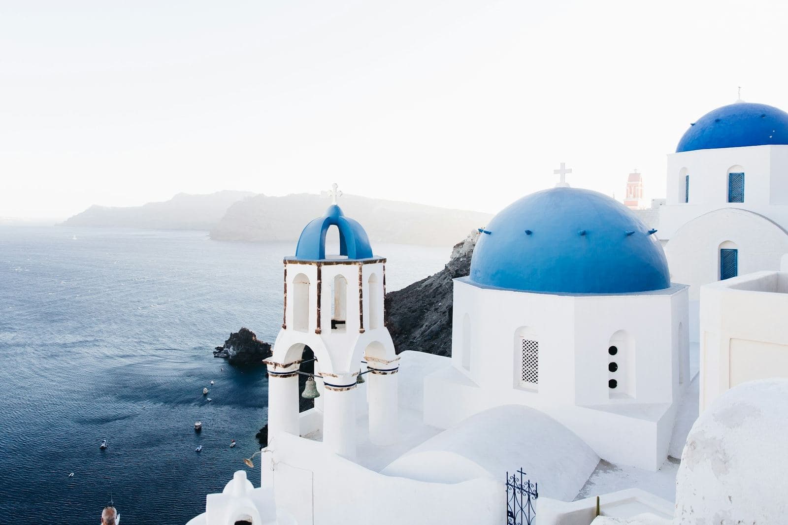 Blue-domed churches above the Santorini caldera in Oia
