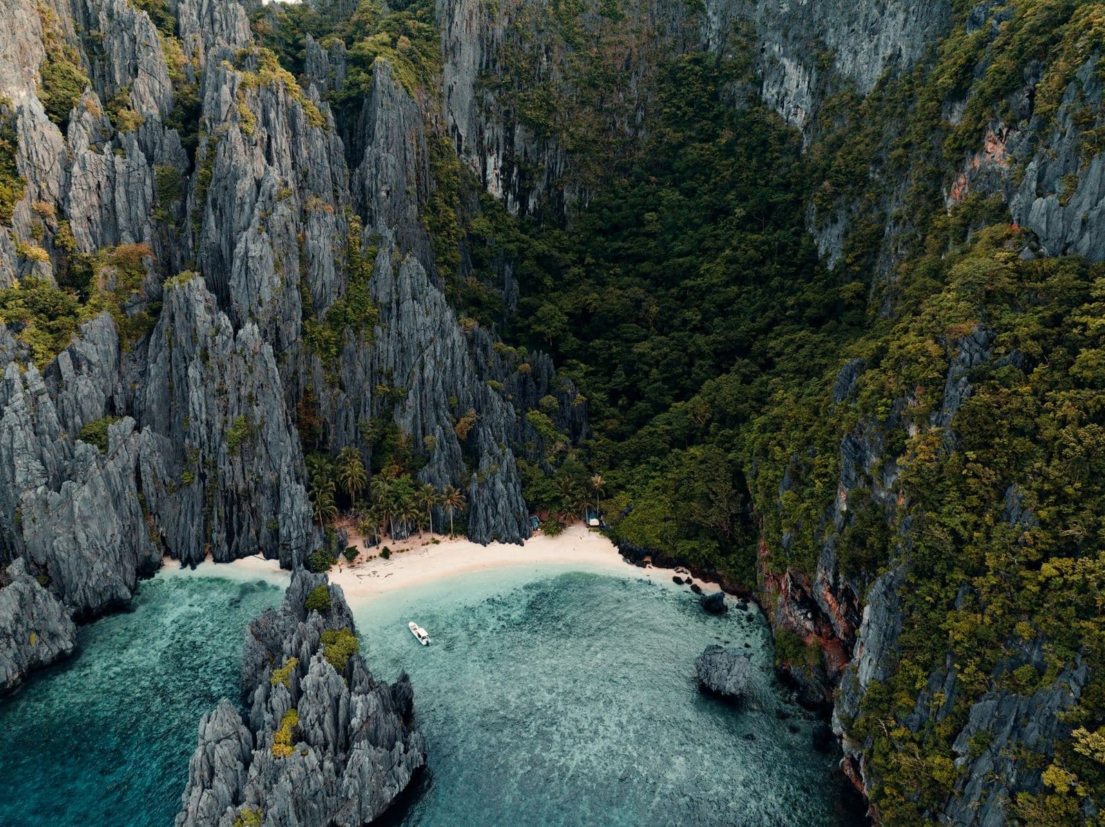 A limestone cove with turquoise water seen from above