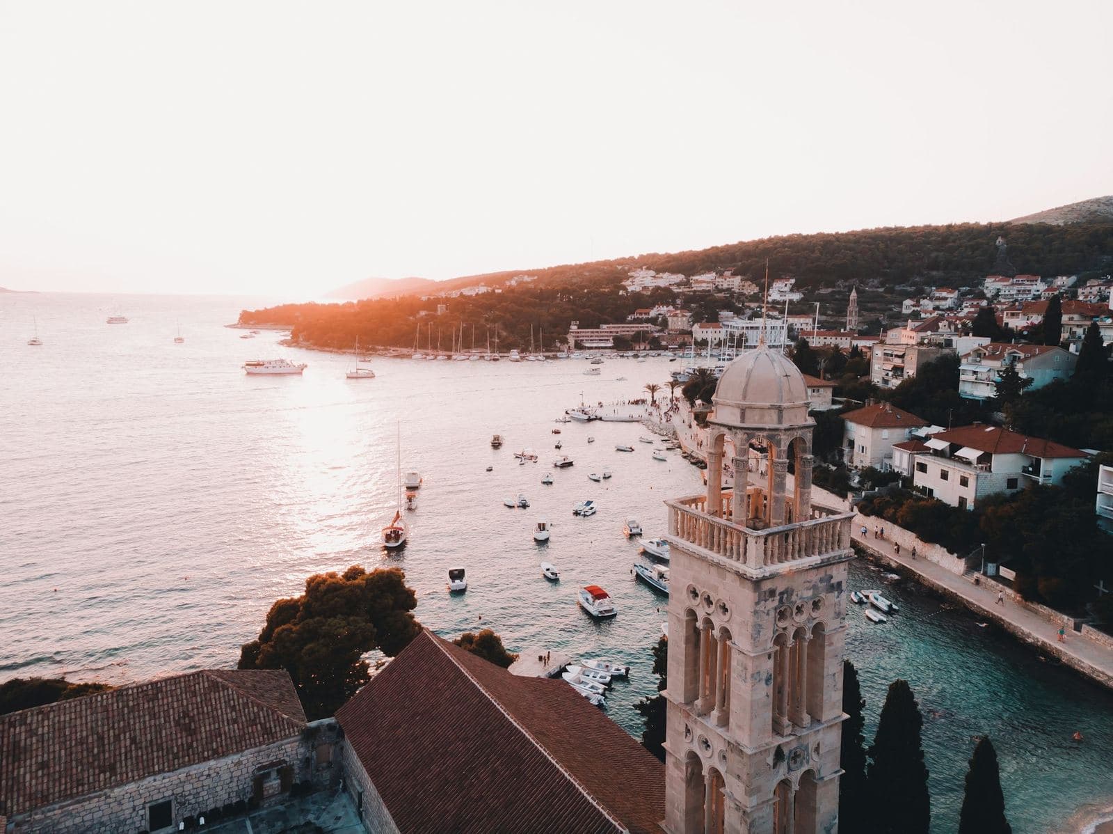 Hvar harbor and bell tower at golden hour