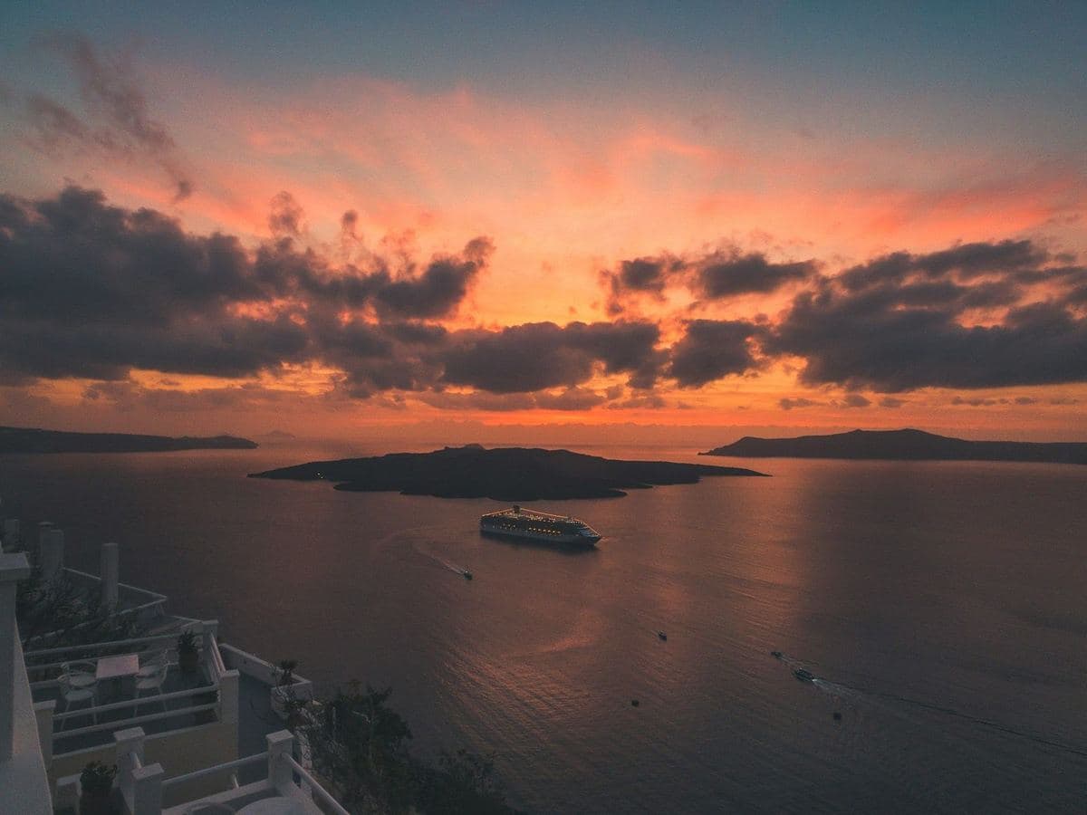 A boat crossing the caldera at sunset